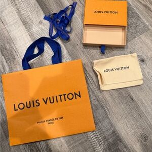 Louis Vuitton Empty small box and dust bag with ribbon and shopping bag.